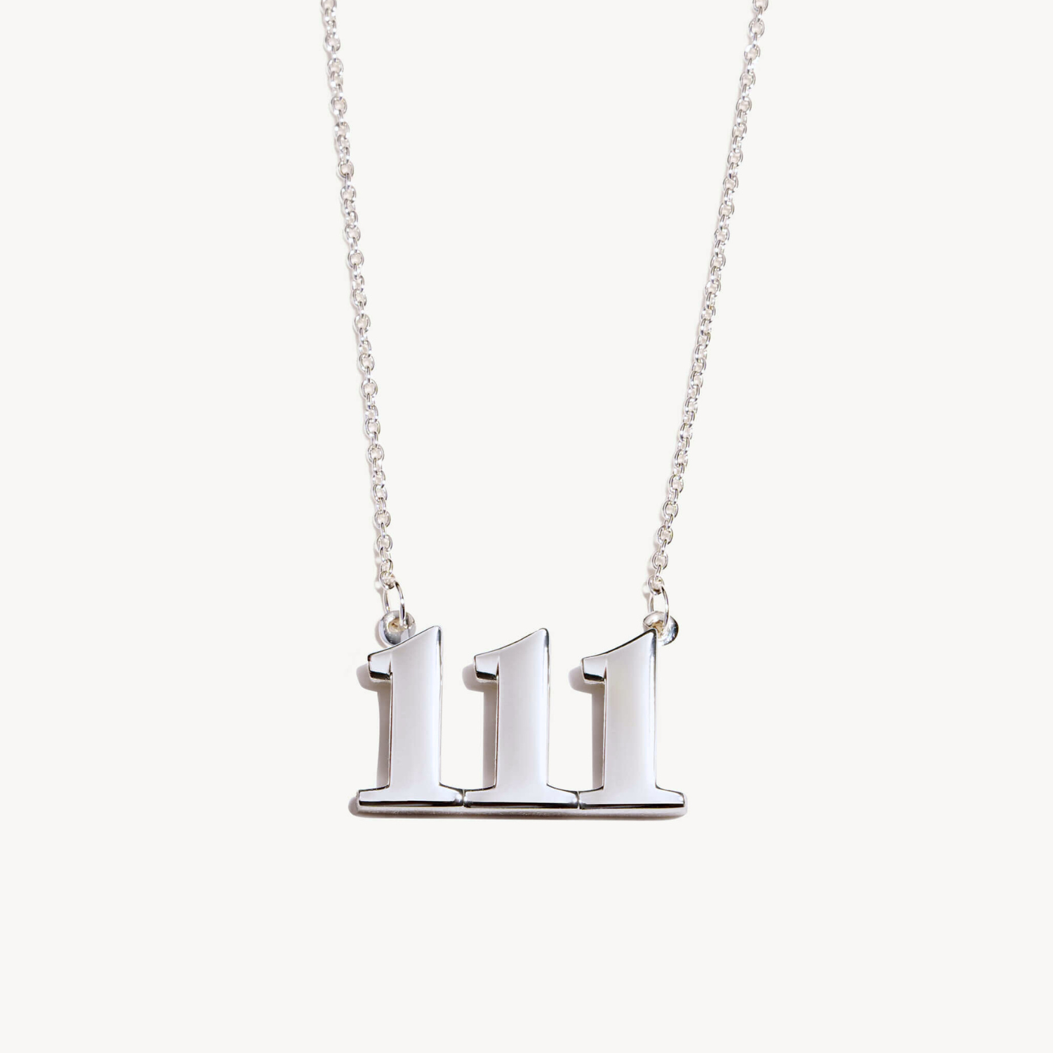 Silver necklace with a unique 111 pendant on a white background