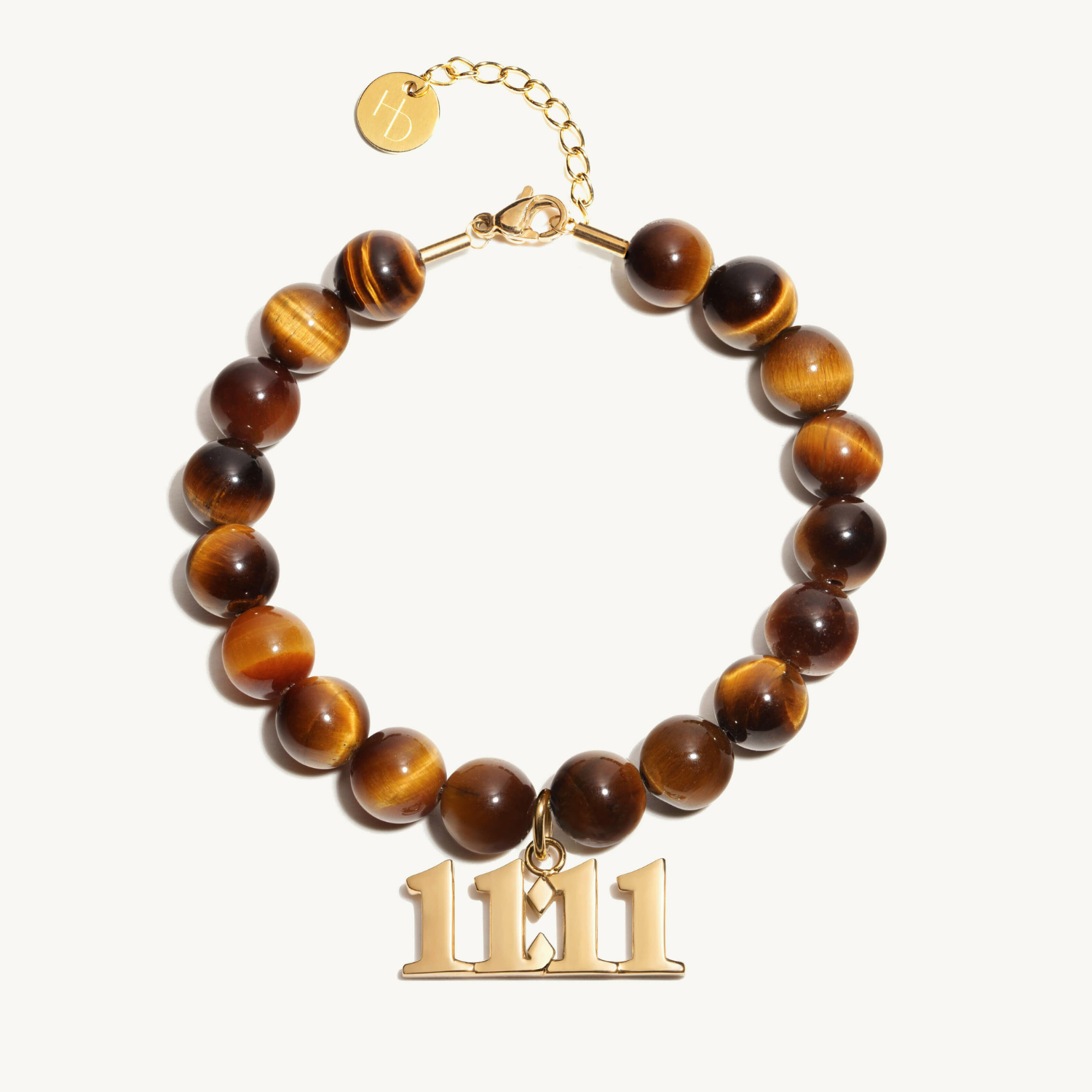 11:11 Tigers Eye beaded bracelet with adjustable clasp closure. 11:11 Gold Charm
