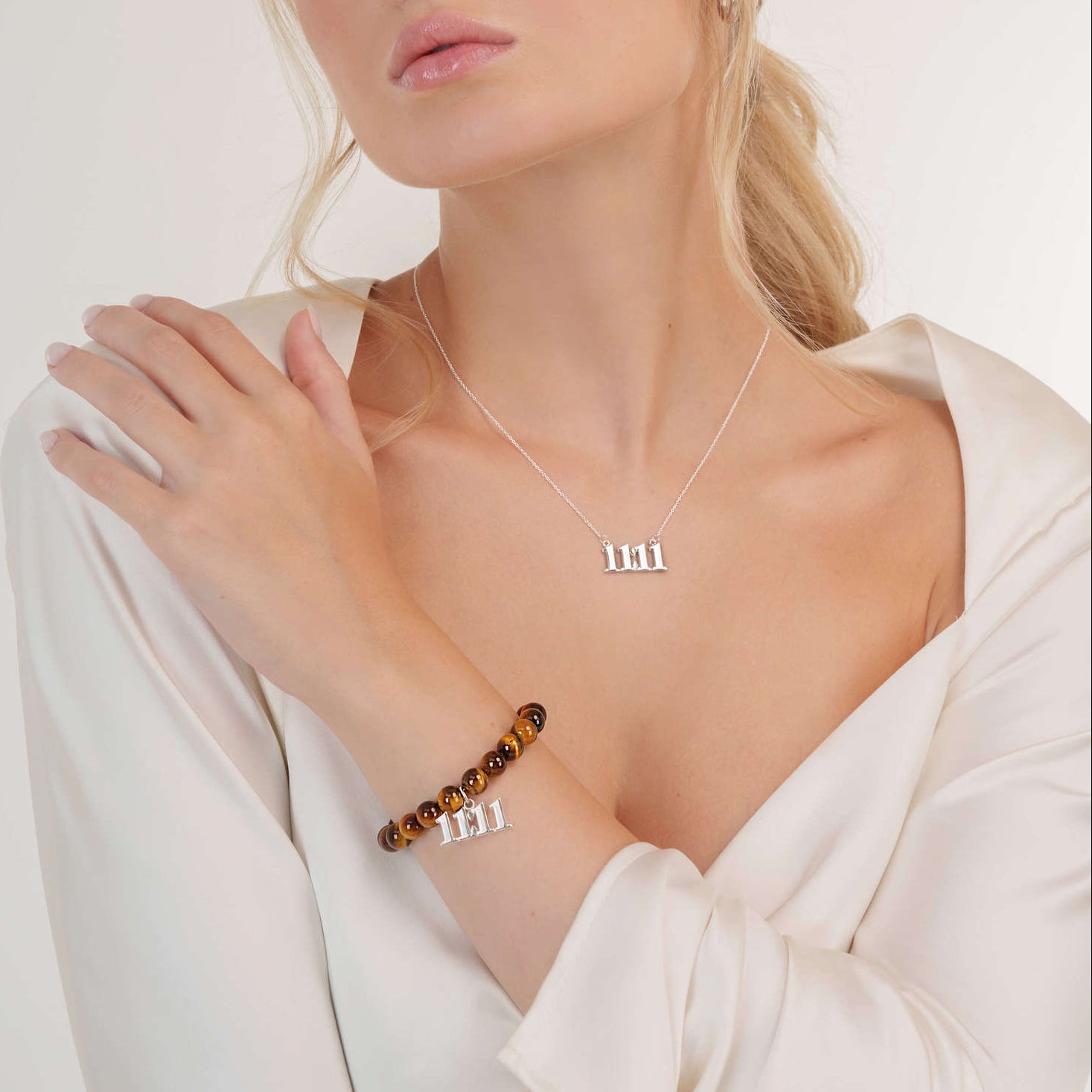 Model wearing an Tigers Eye 11:11 Silver bracelet with a matching 11:11 Silver necklace
