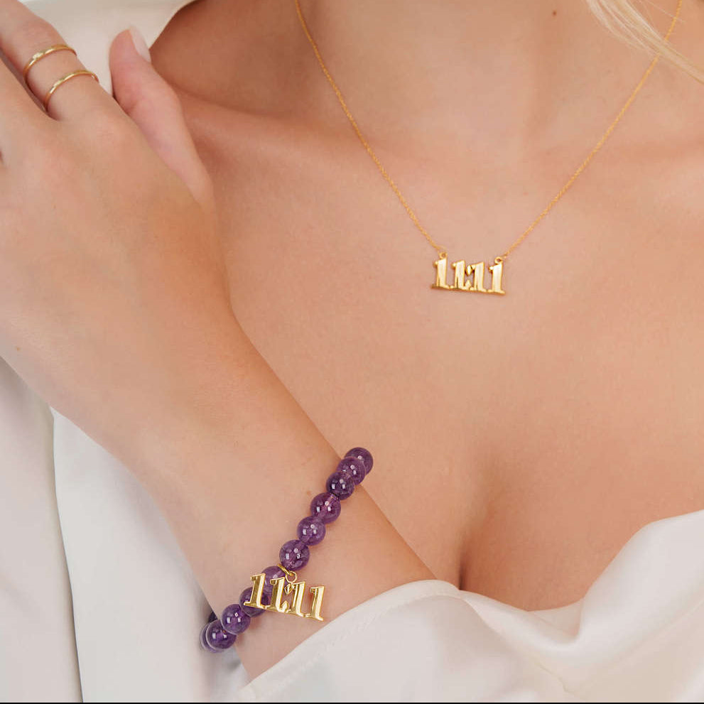 Model wearing a 888 gold amethyst bracelet with a matching 888 gold necklace