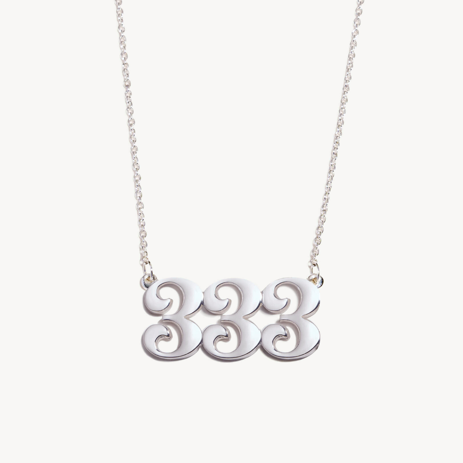 Silver necklace with a 333 unique design pendant on a white background