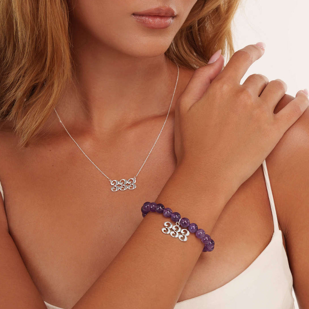 Model wearing an amethyst 333 silver bracelet with a matching 333 silver necklace