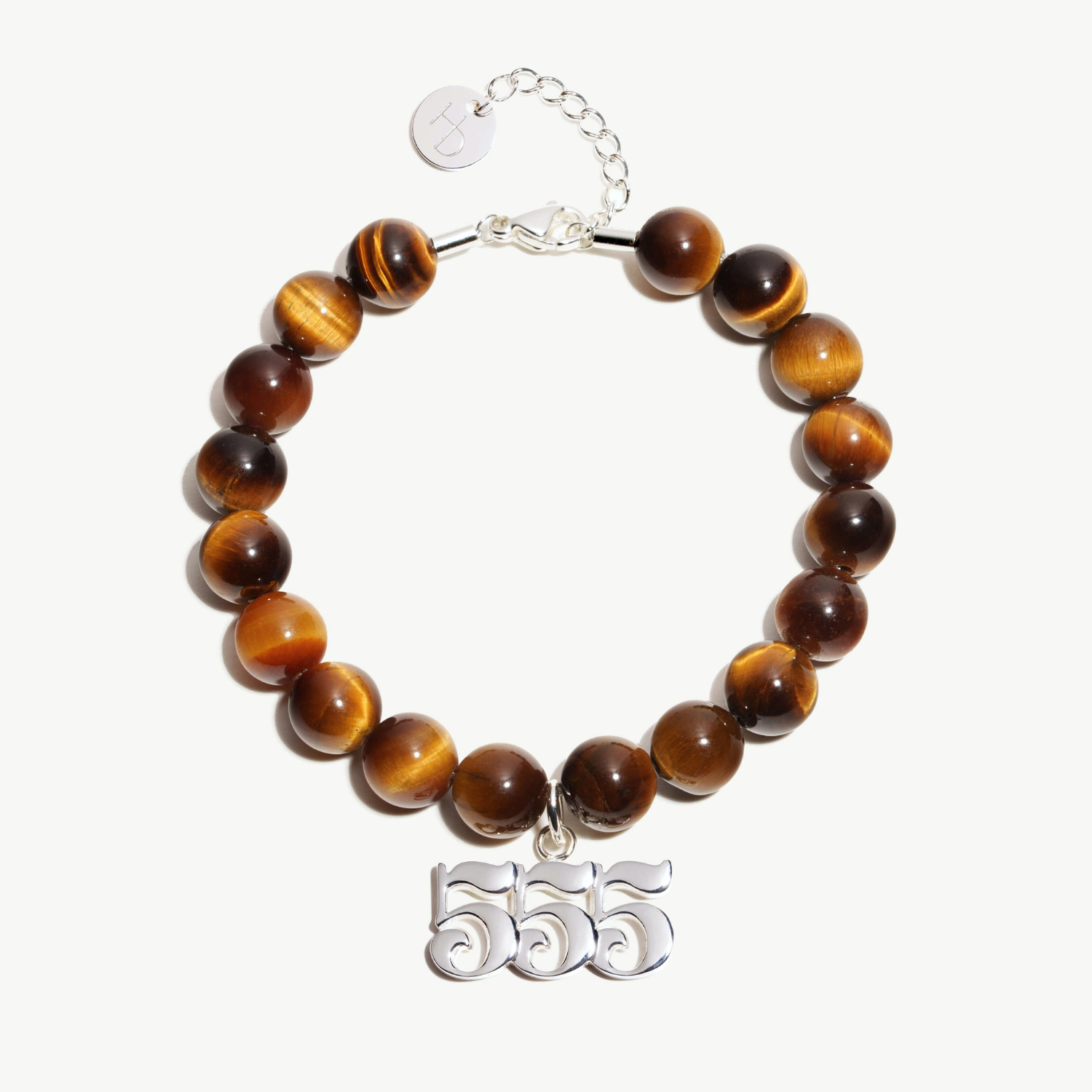 555 Tigers Eye beaded bracelet with adjustable clasp closure. 555 Silver Charm