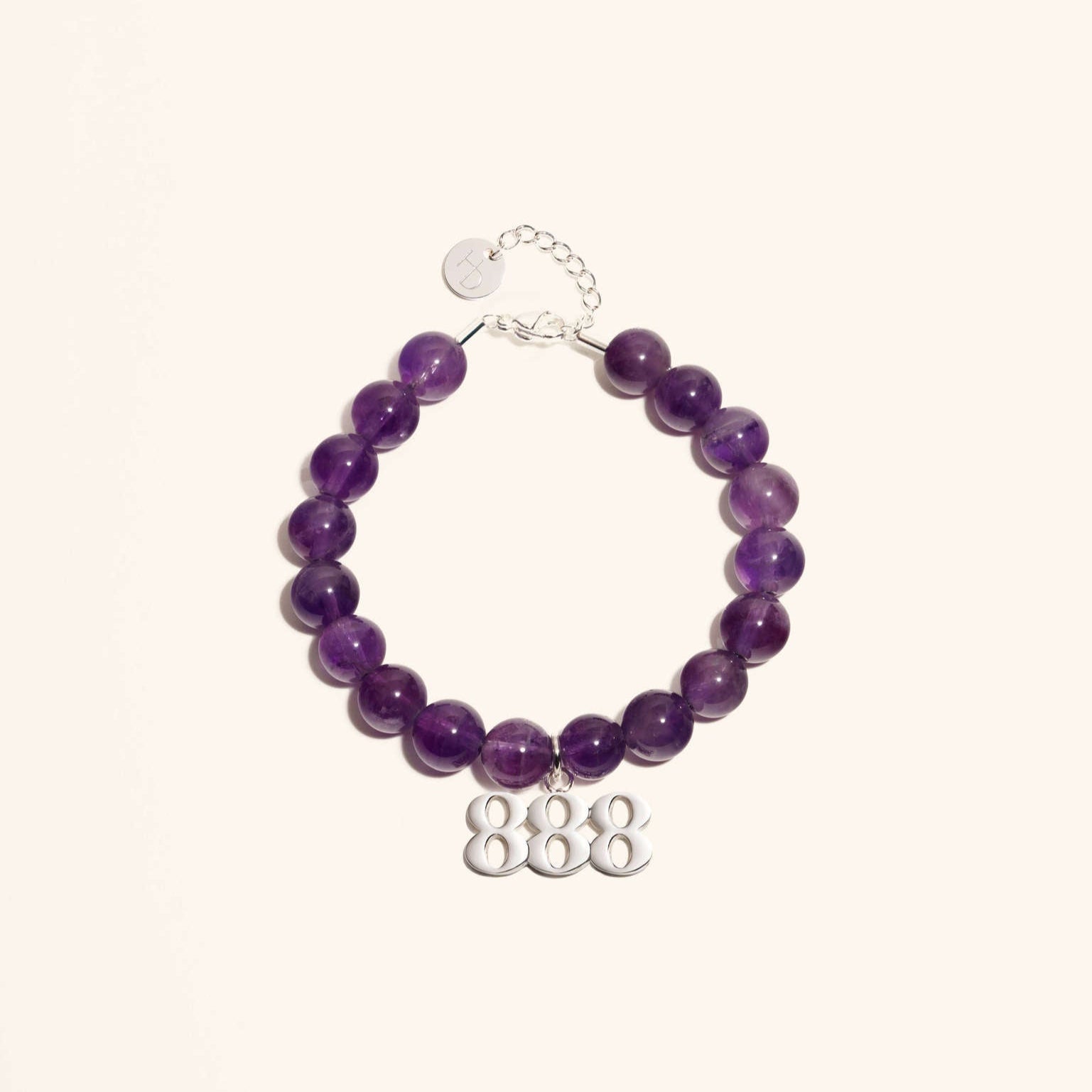 An Amethyst gemstone bracelet with a silver 888 angel number charm, featuring a chain and clasp made from premium stainless steel.