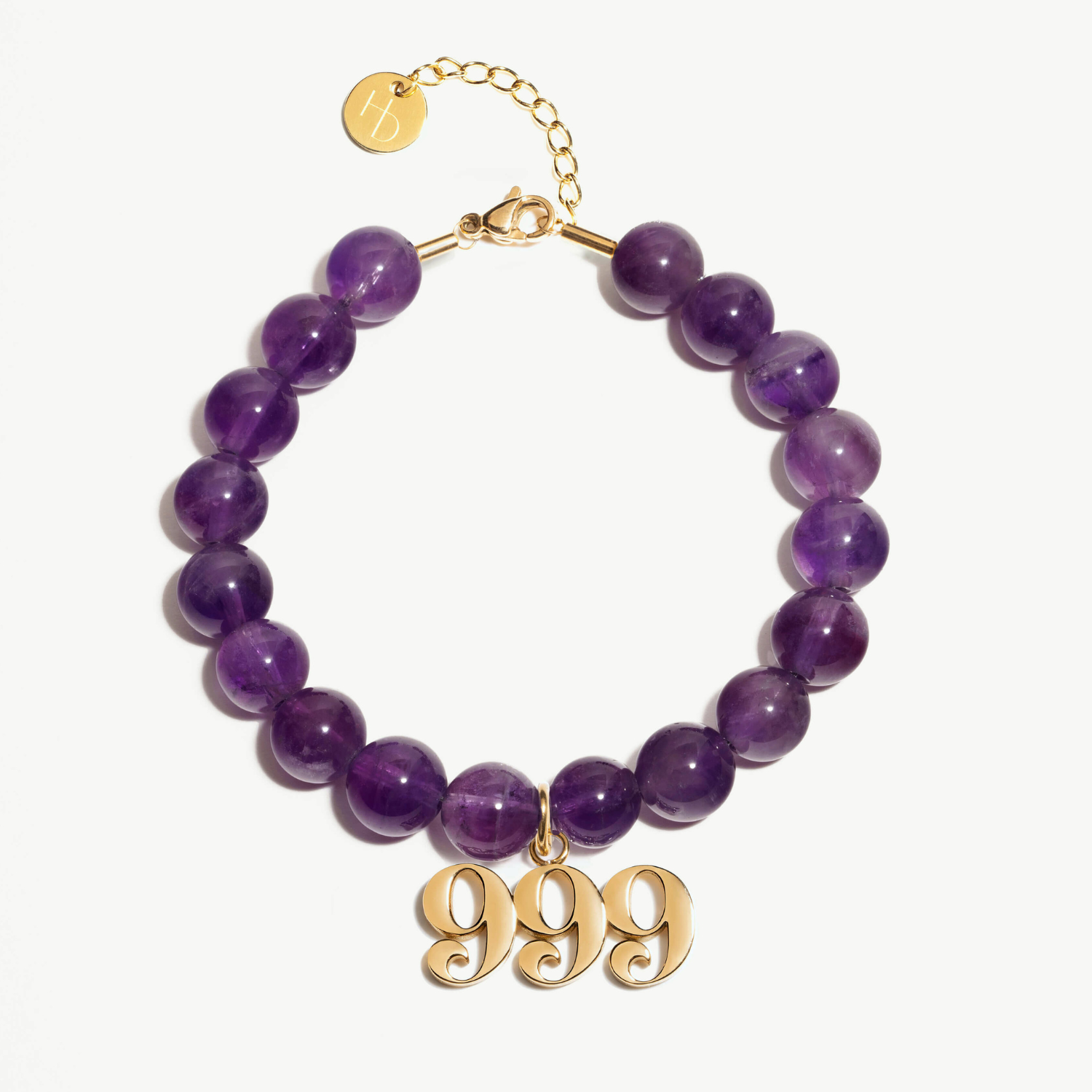 999 Amethyst beaded bracelet with adjustable clasp closure. 999 gold charm
