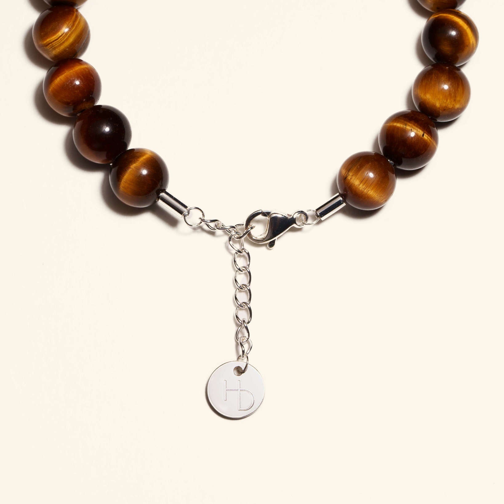 Tigers Eye Silver charm bracelet close up showing the adjustable length extender and clasp