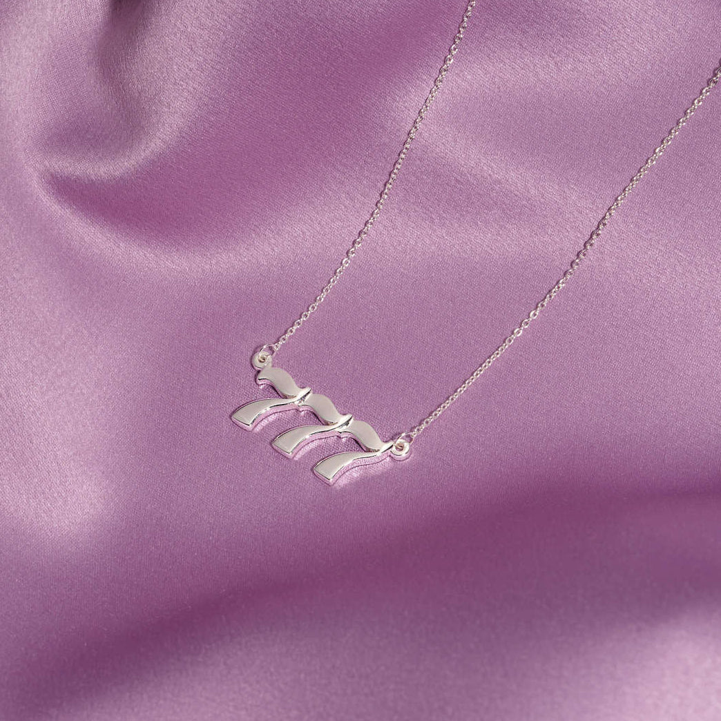 silver necklace with 777 pendant