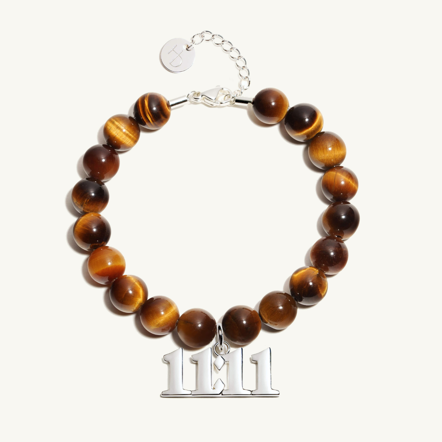 11:11 Tigers Eye beaded bracelet with adjustable clasp closure. 11:11 Silver Charm
