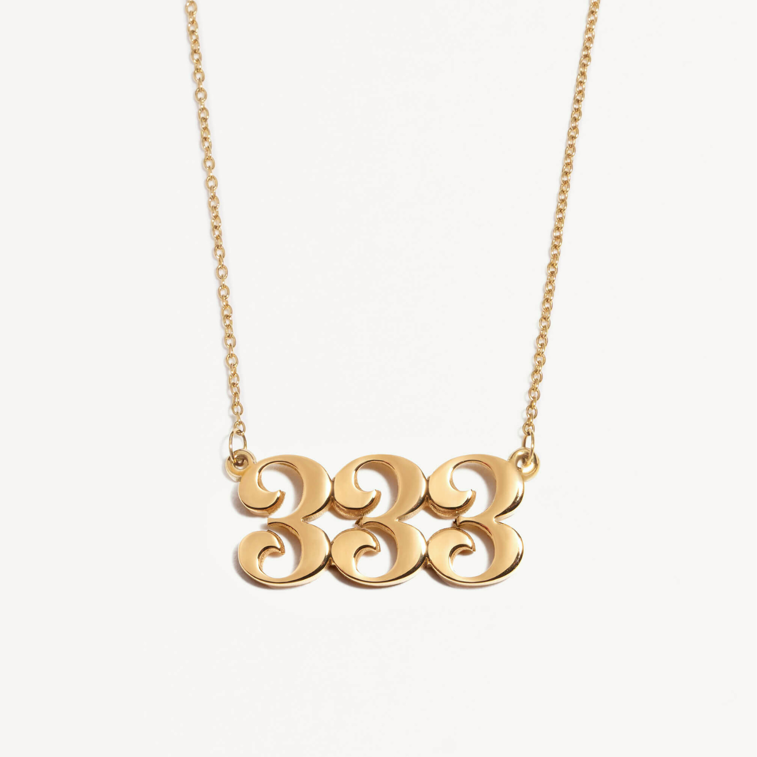 333 necklace in gold with unique pendant design