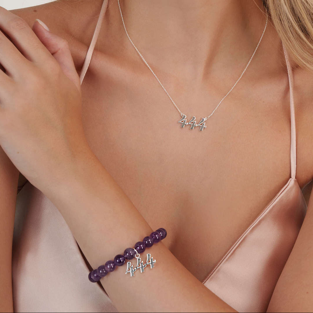 Model wearing an amethyst 444 silver bracelet with a matching 444 silver necklace
