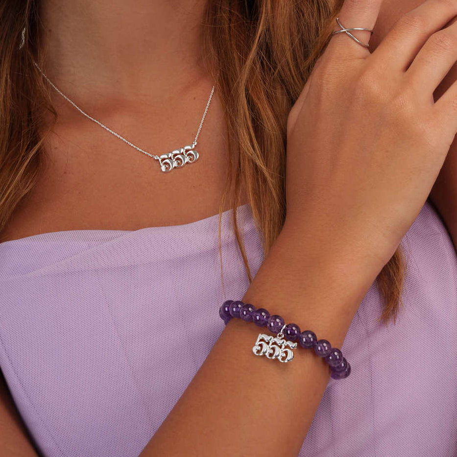 Model wearing an amethyst 555 silver bracelet with a matching 555 silver necklace

