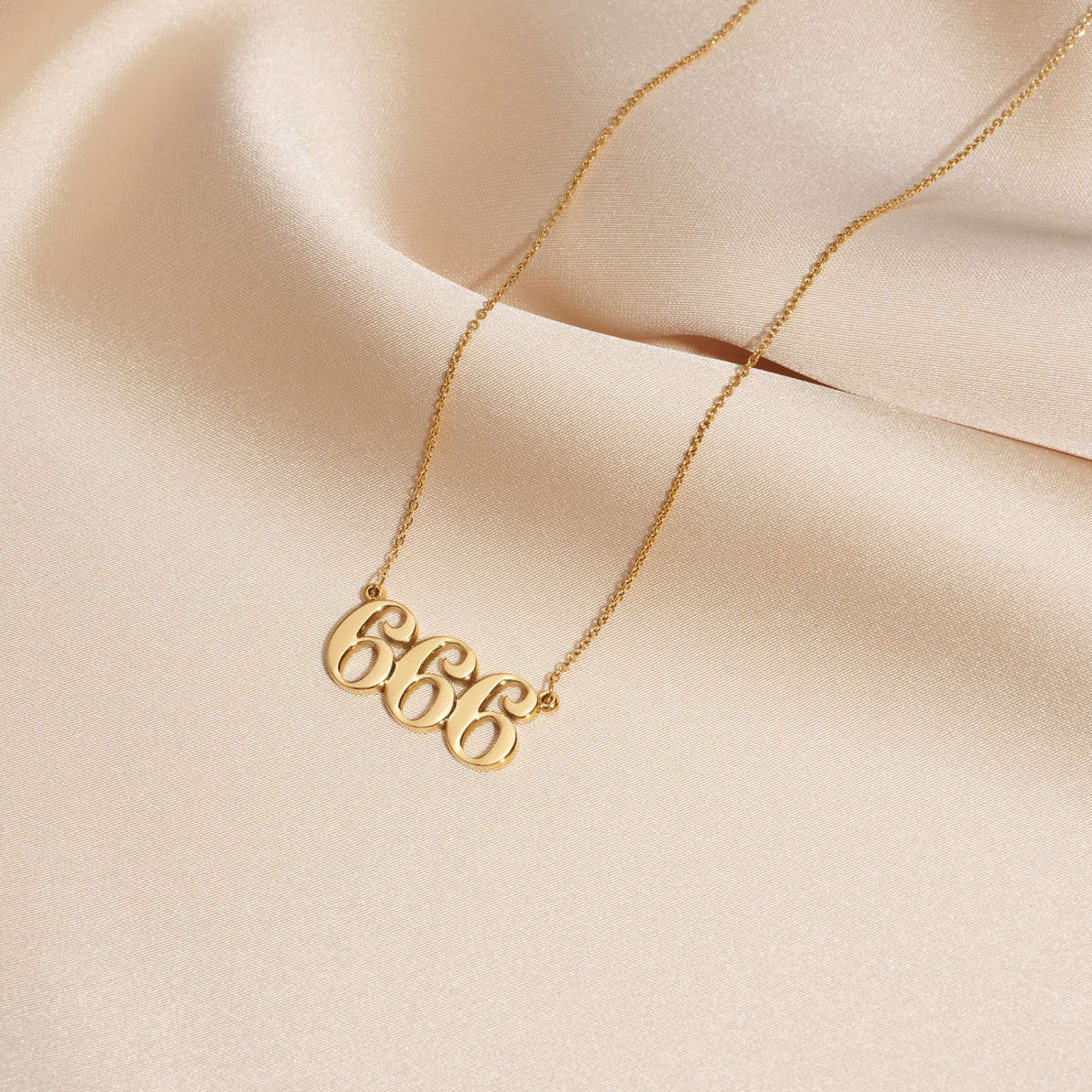666 necklace gold on silk with unique design