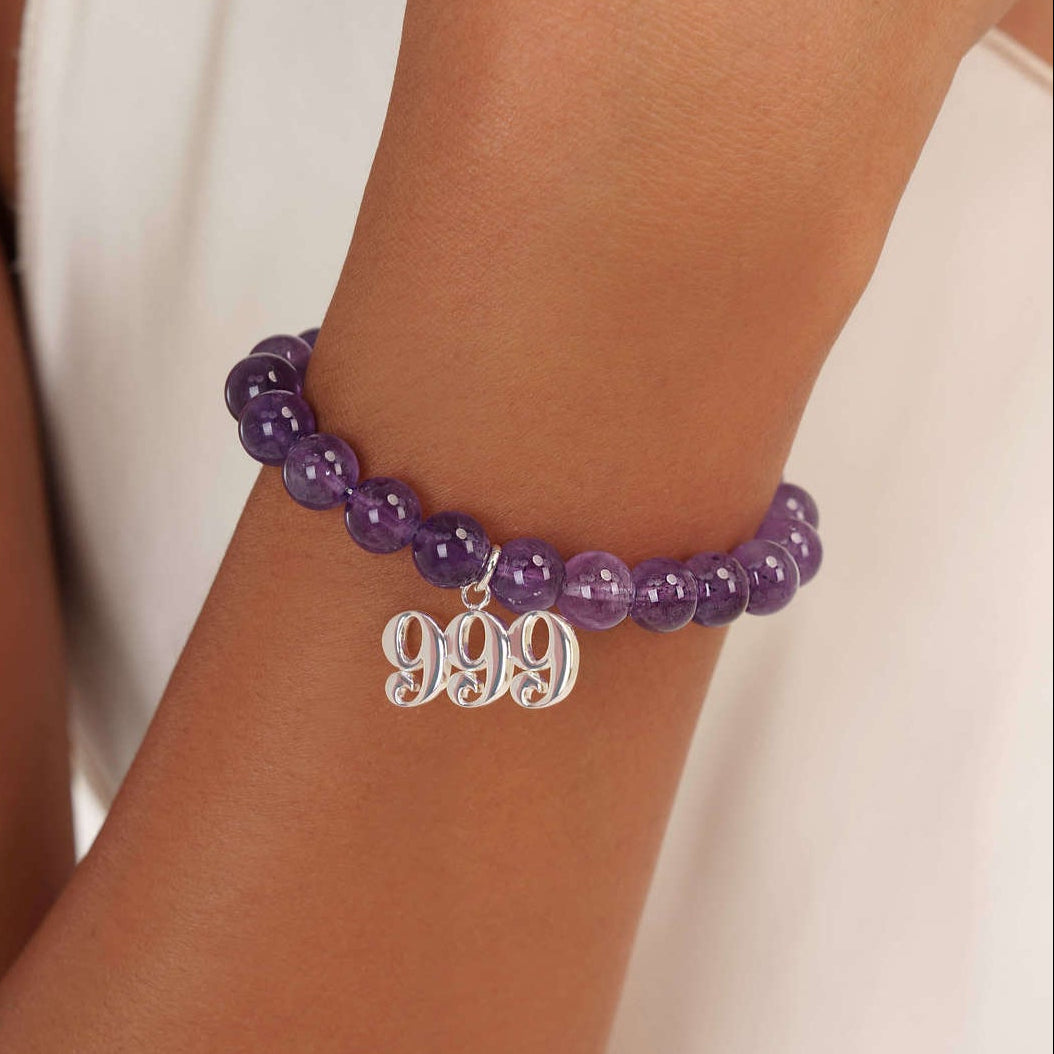 999 Amethyst beaded bracelet with adjustable clasp closure. 999 Silver Charm
