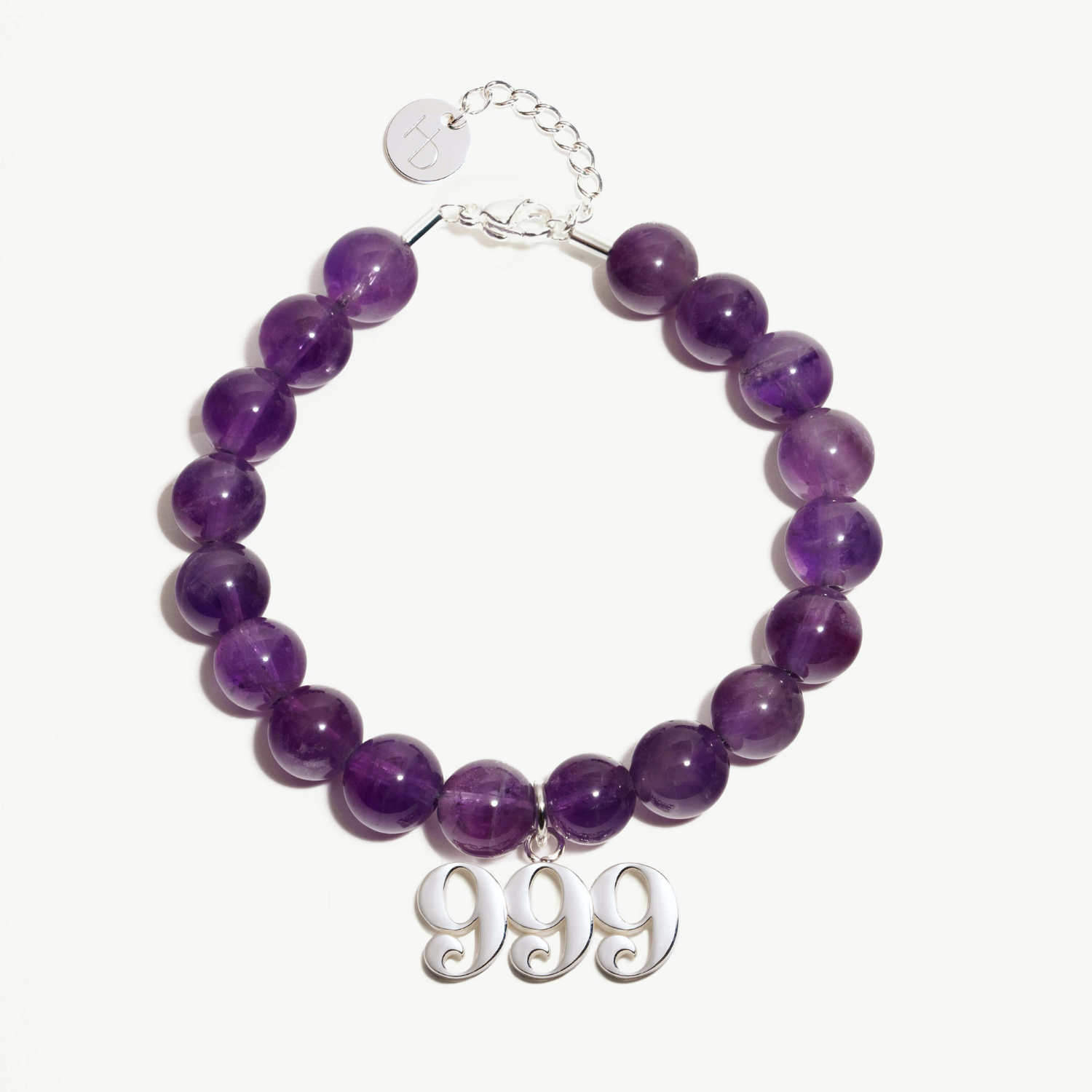 999 Amethyst beaded bracelet with adjustable clasp closure. 999 Silver Charm
