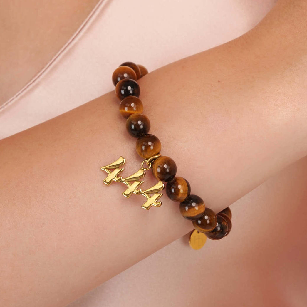 High quality Tigers Eye beads with dangling 444 Gold charm on wrist
